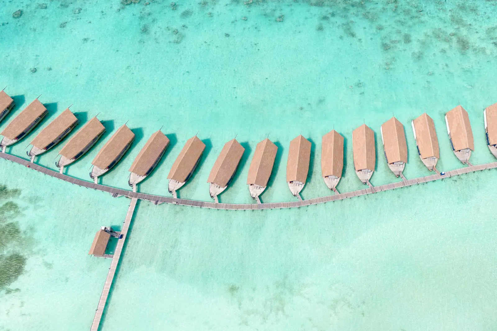 Aerial view of overwater villas in the Maldives