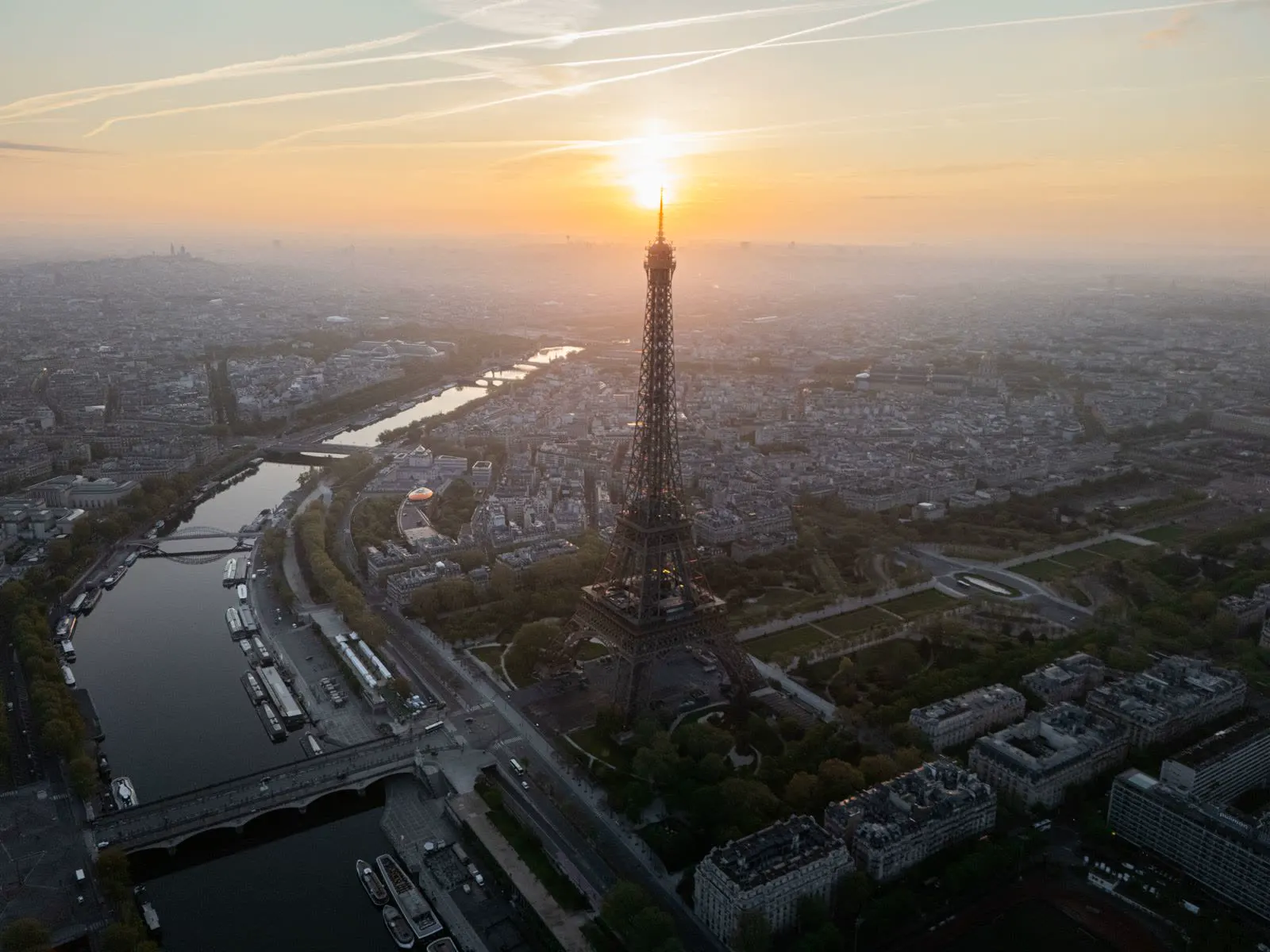 Eiffel Tower at sunrise over Paris rooftops