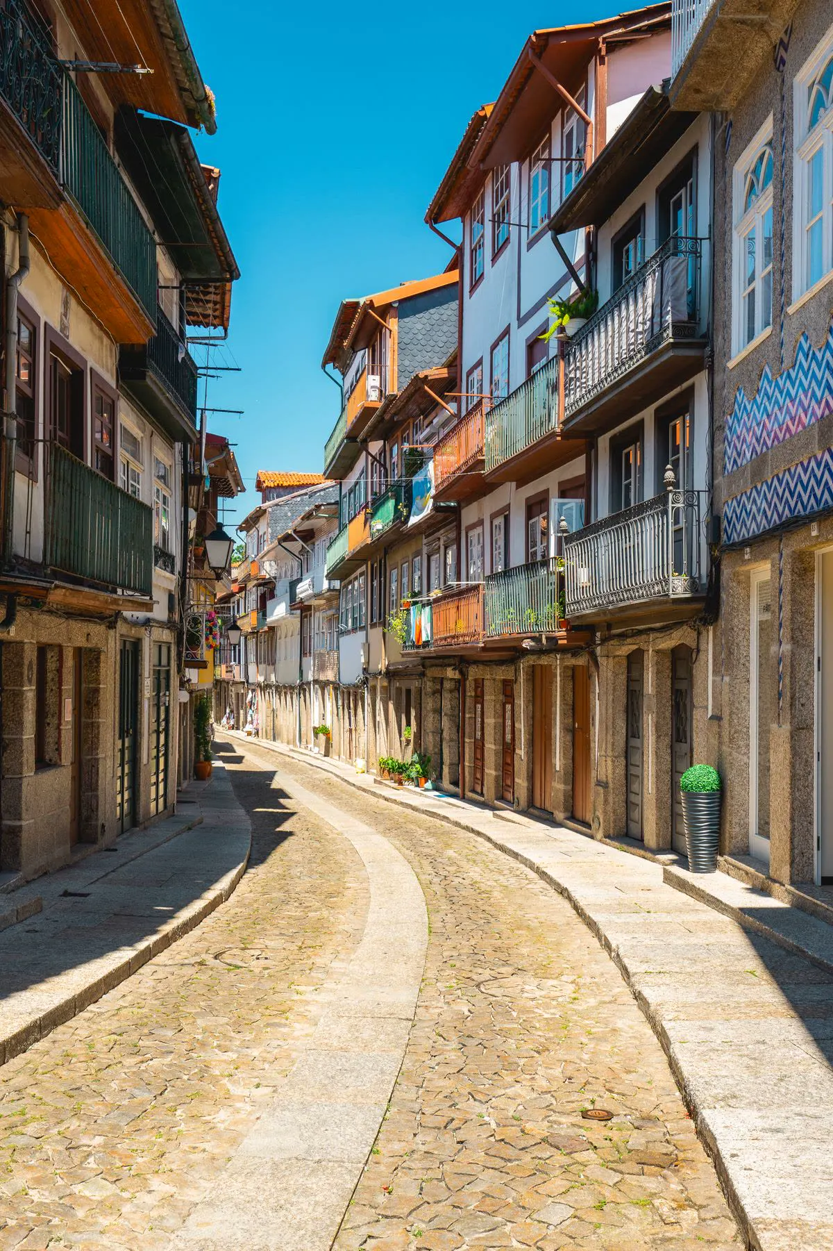 Cobbled old-town street lined with historic buildings