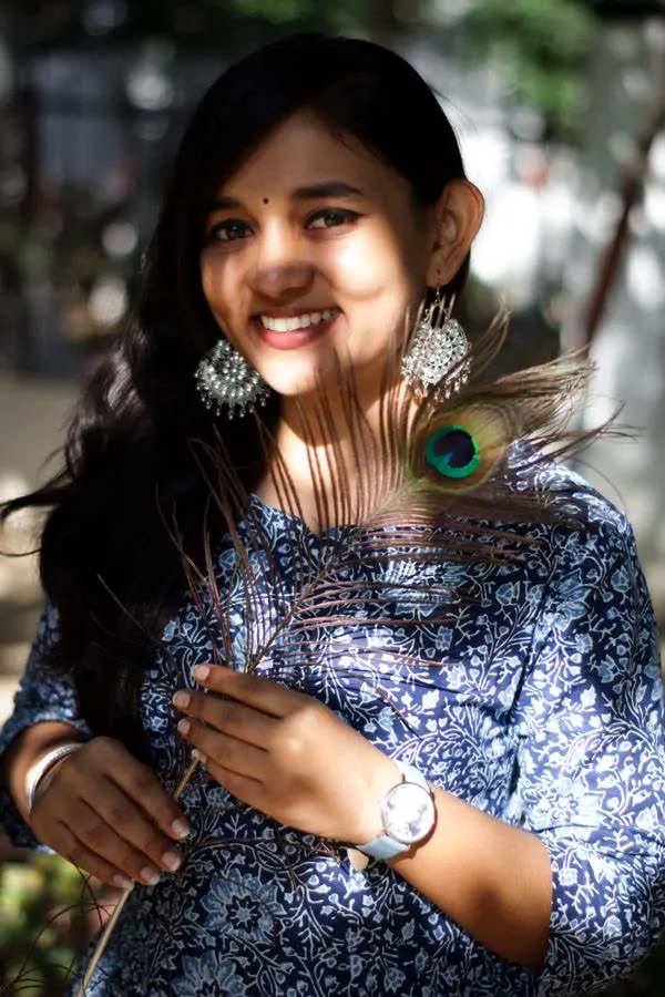 Portrait of Nisha Menon, wellness host